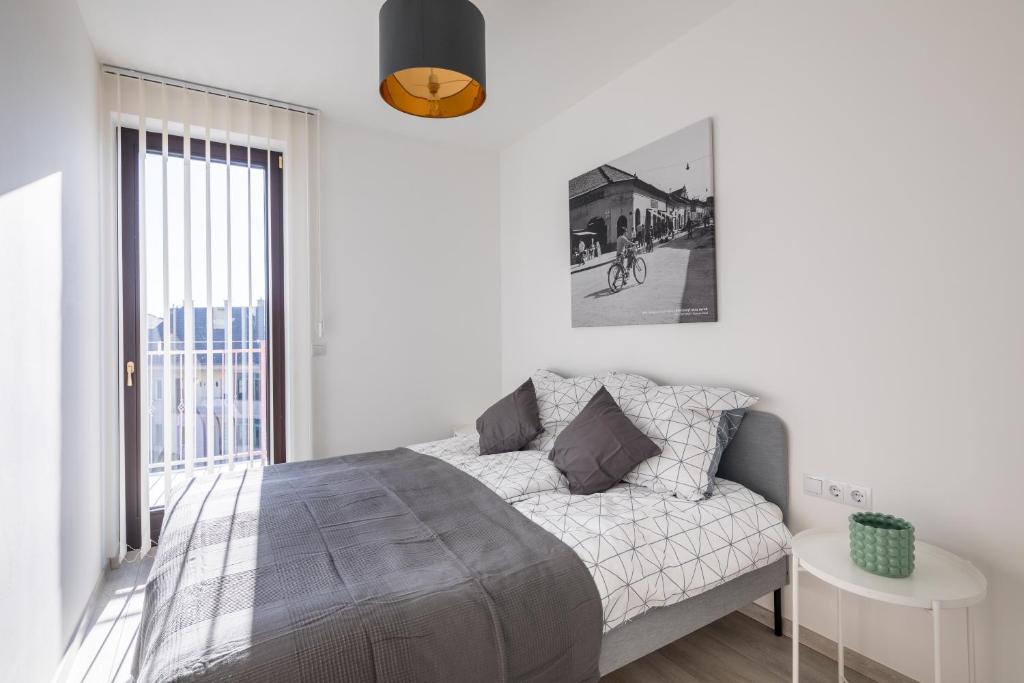 Postel nebo postele na pokoji v ubytování Stafétaház Apartmanok