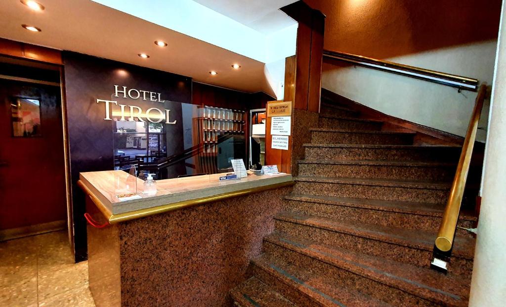 
a large stairway leading to a large room at Hotel Tirol in Mar del Plata
