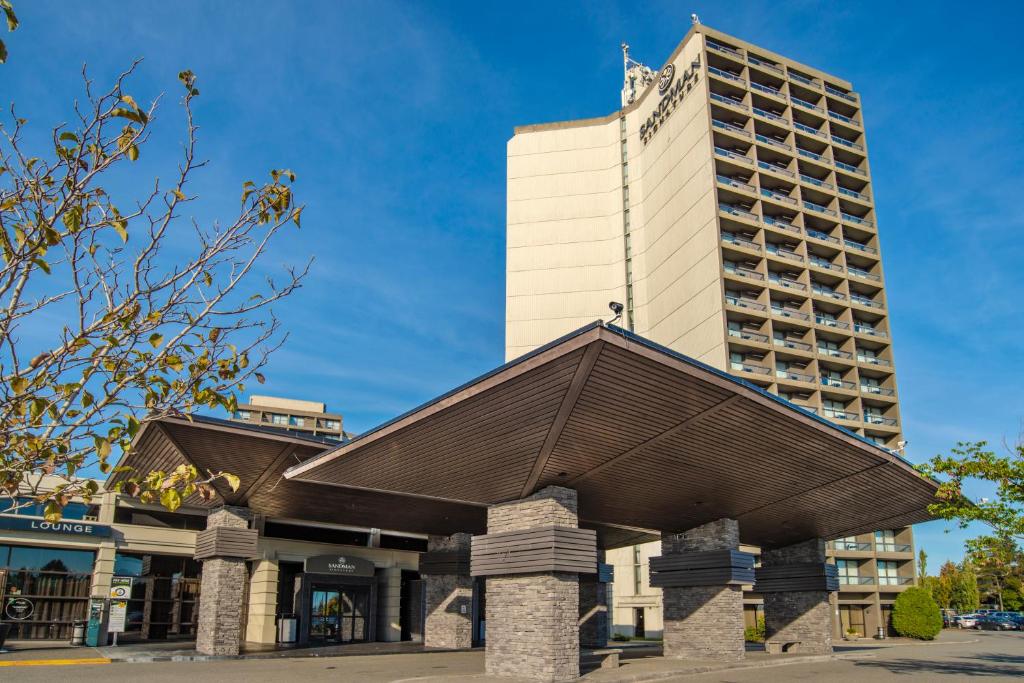 a building with a pointed roof in front of it at Sandman Signature Vancouver Airport Hotel & Resort in Richmond