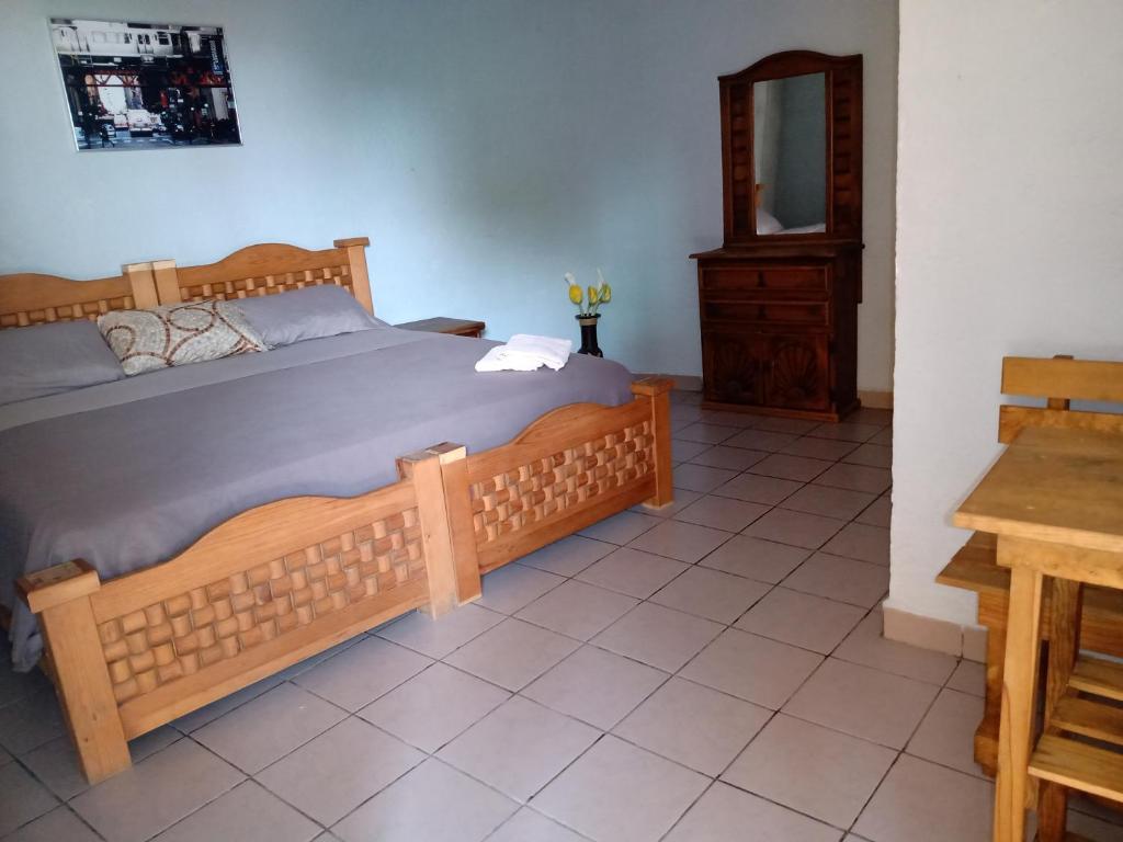 Postel nebo postele na pokoji v ubytování Hospedaje San Antonio Tepoztlán.