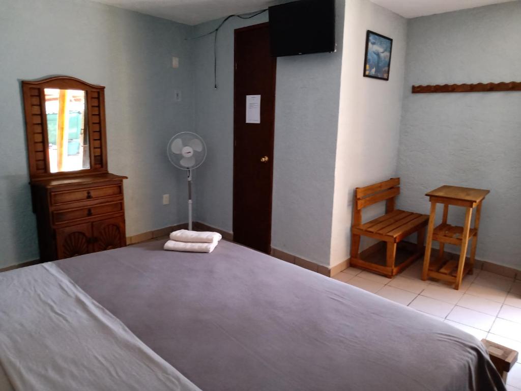Postel nebo postele na pokoji v ubytování Hospedaje San Antonio Tepoztlán.