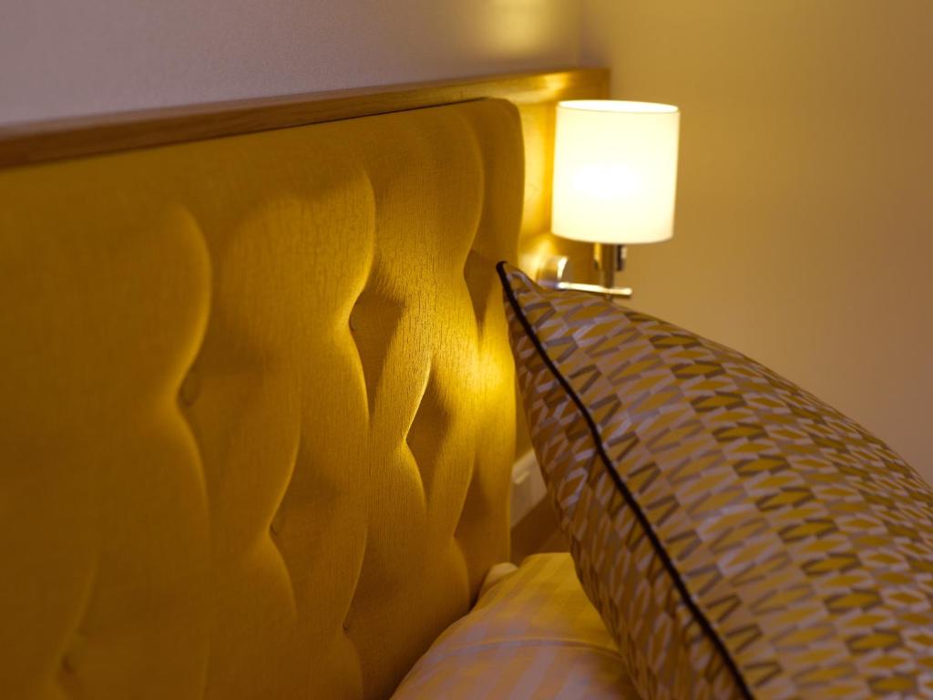 Una cama o camas en una habitación de Hotel Drei Raben