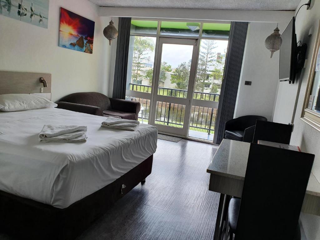Postel nebo postele na pokoji v ubytování Le George Motel