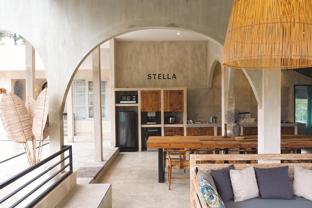 a living room with a couch and a table at Villa Stella By The Villas 100 in Bogor