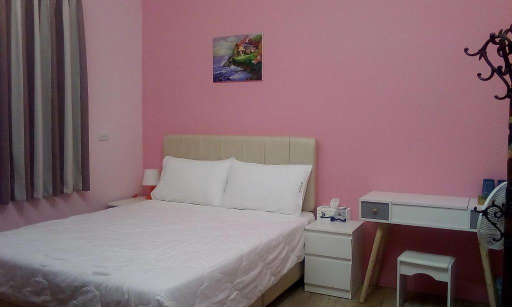 Postel nebo postele na pokoji v ubytování 囬鄉偶寓