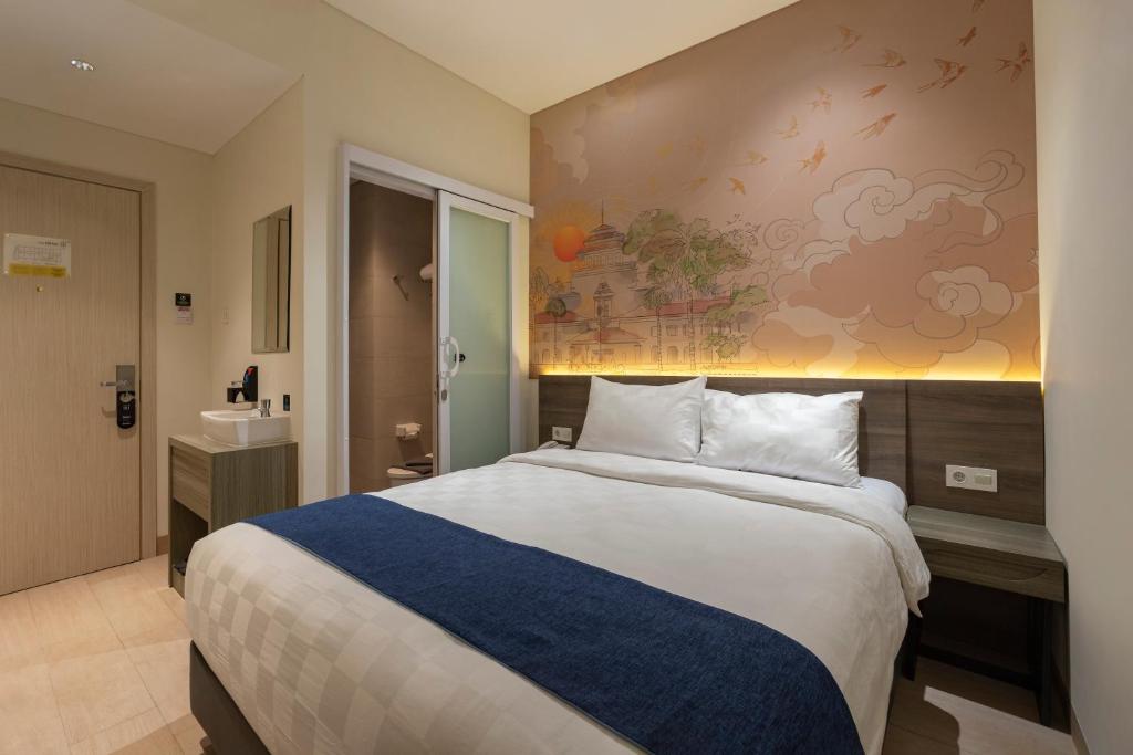 Postel nebo postele na pokoji v ubytování Hotel 88 Alun Alun Bandung By WH