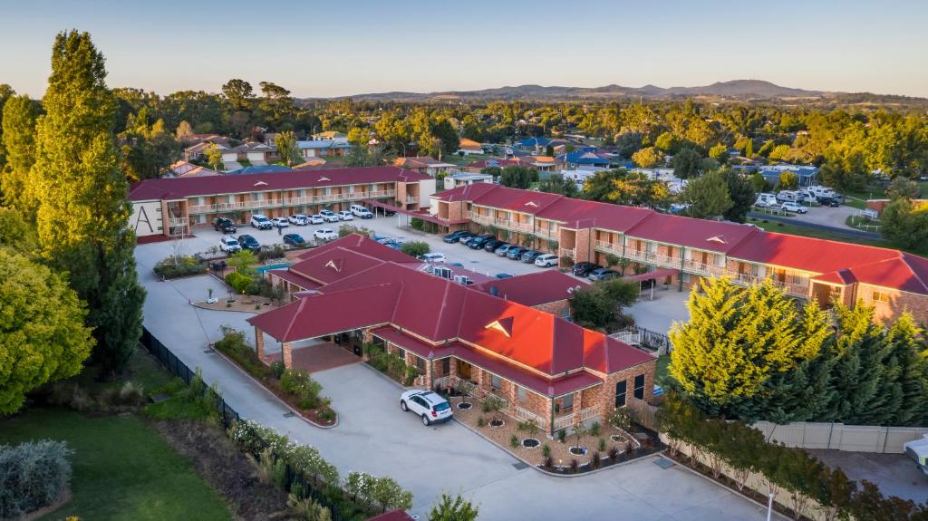 an aerial view of a hotel with a parking lot at Ambassador Orange in Orange