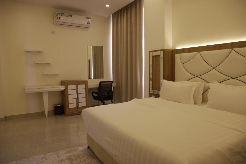 Postel nebo postele na pokoji v ubytování فندق المستقبل للشقق الفندقية ALMUSTAQBAL HOTEL Apartments