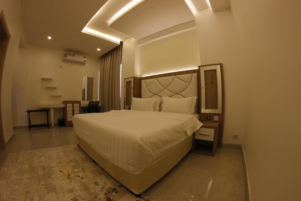Postel nebo postele na pokoji v ubytování فندق المستقبل للشقق الفندقية ALMUSTAQBAL HOTEL Apartments
