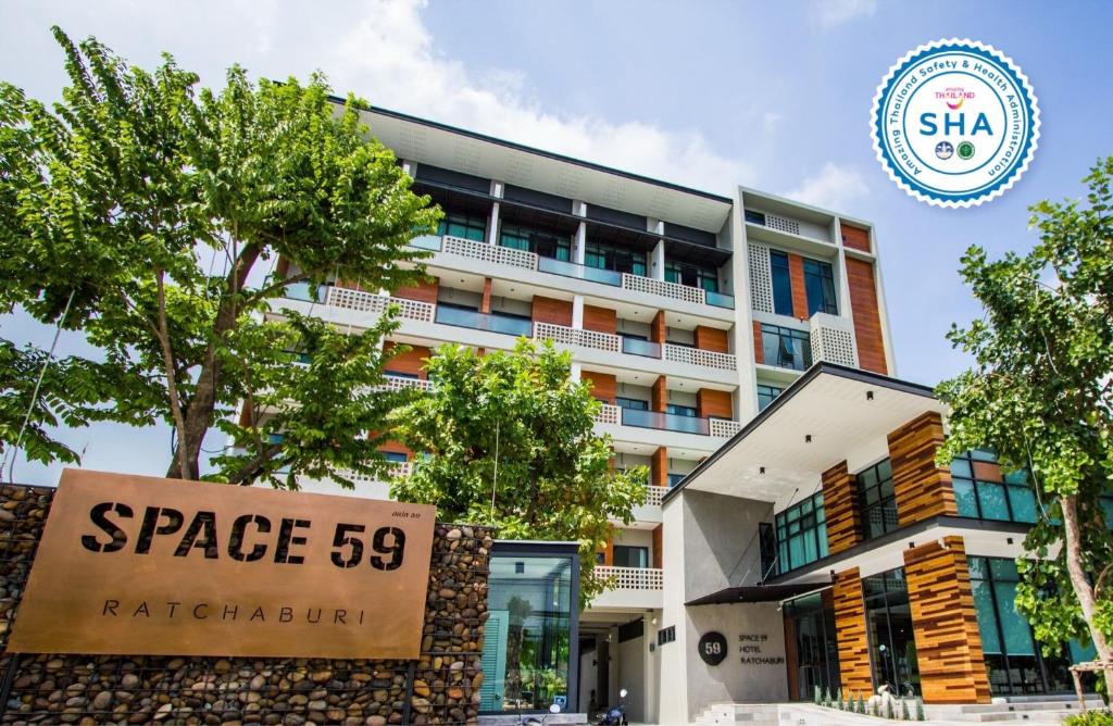 a building with a sign that reads space raleigh at Space59 Hotel in Ratchaburi