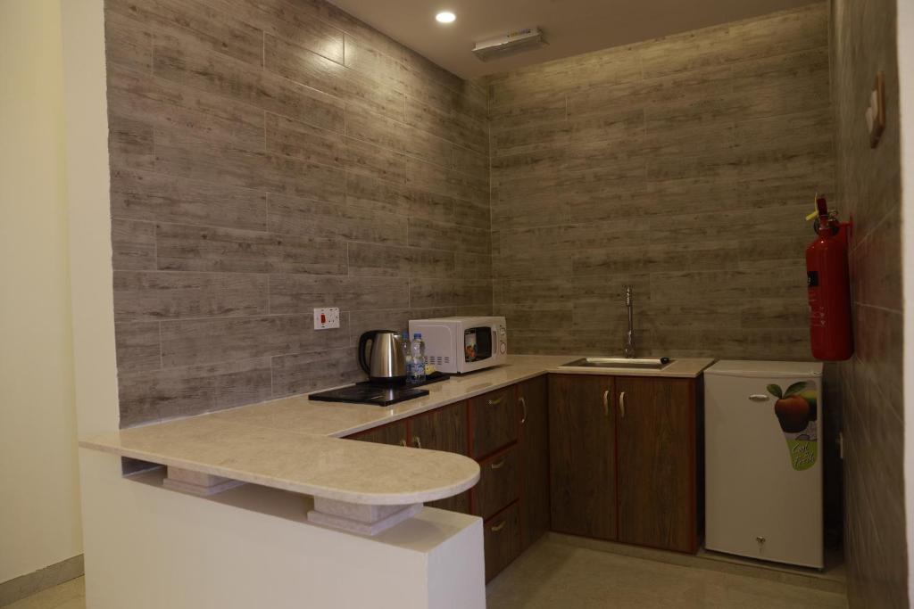 Kuchyň nebo kuchyňský kout v ubytování فندق المستقبل للشقق الفندقية ALMUSTAQBAL HOTEL Apartments