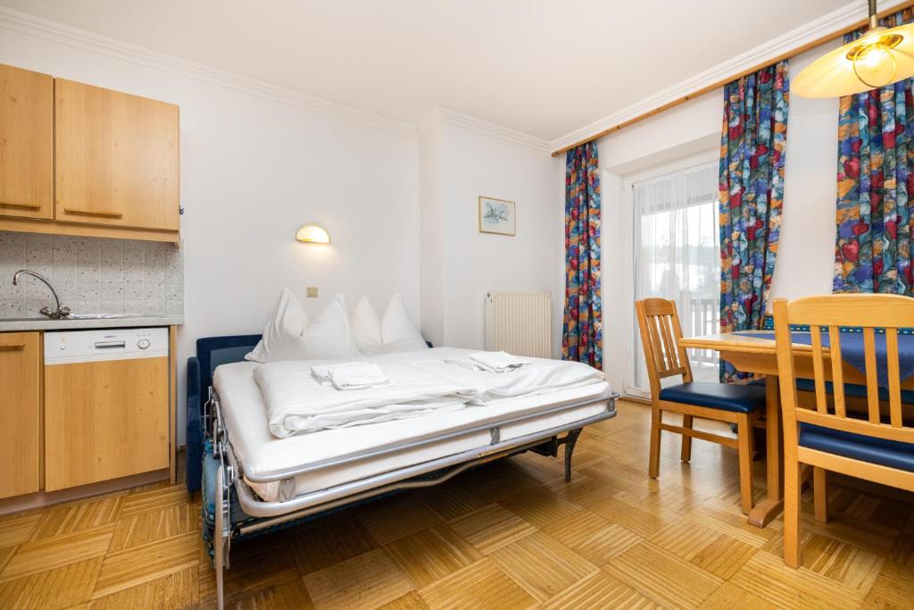 Posteľ alebo postele v izbe v ubytovaní Aparthotel am Reitecksee