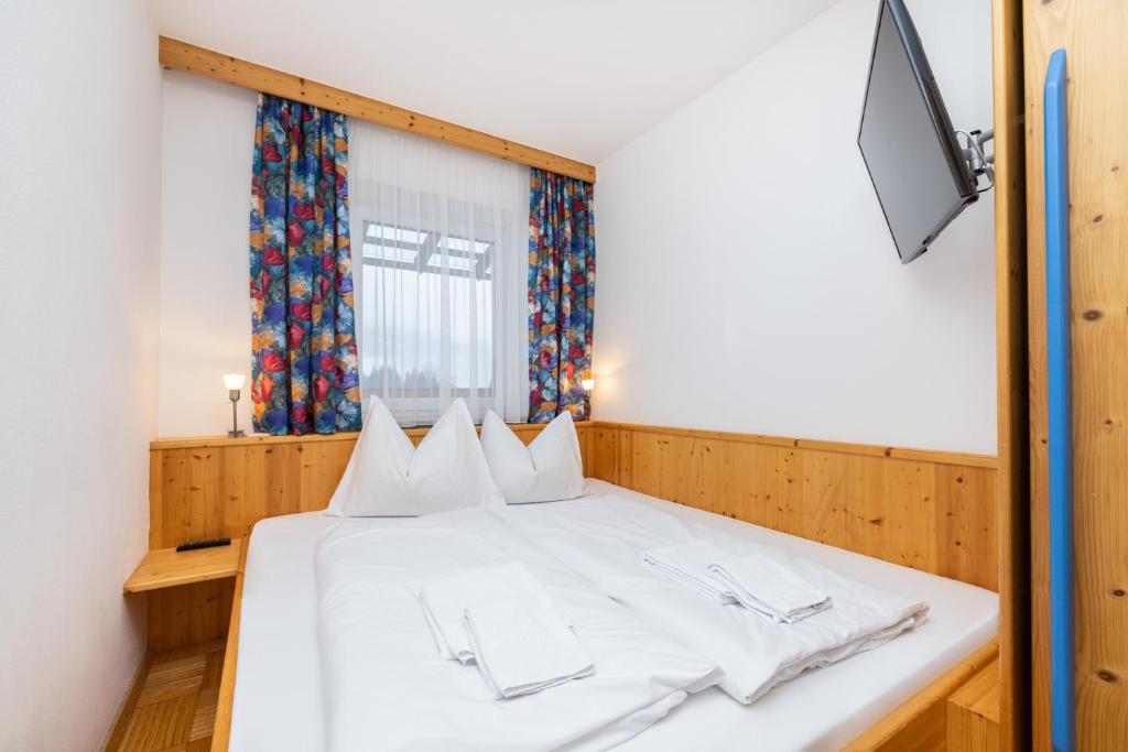 Posteľ alebo postele v izbe v ubytovaní Aparthotel am Reitecksee
