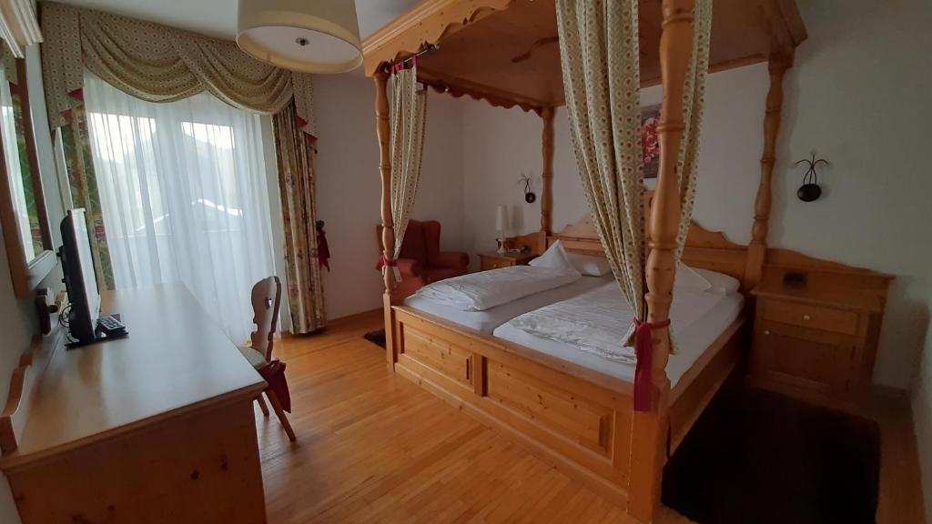Postel nebo postele na pokoji v ubytování Parc Hotel Florian