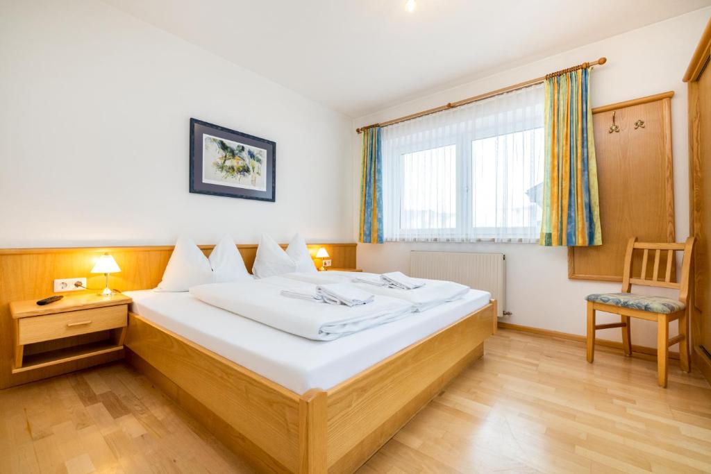 Posteľ alebo postele v izbe v ubytovaní Aparthotel am Reitecksee
