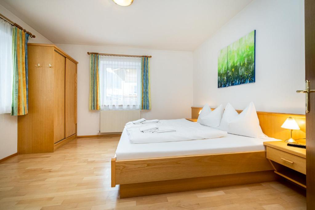 Posteľ alebo postele v izbe v ubytovaní Aparthotel am Reitecksee