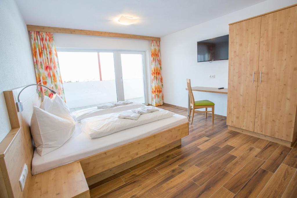 Posteľ alebo postele v izbe v ubytovaní Aparthotel am Reitecksee