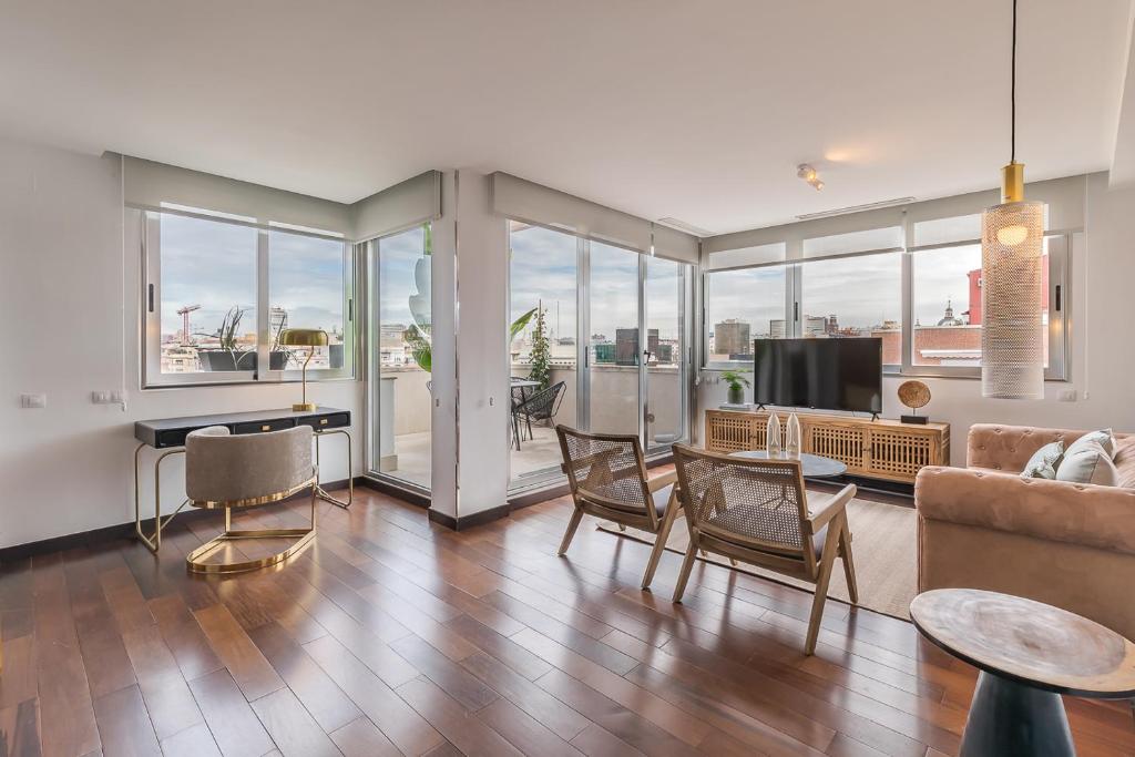 a living room with a couch and a table at Madrid Rental Flats in Madrid