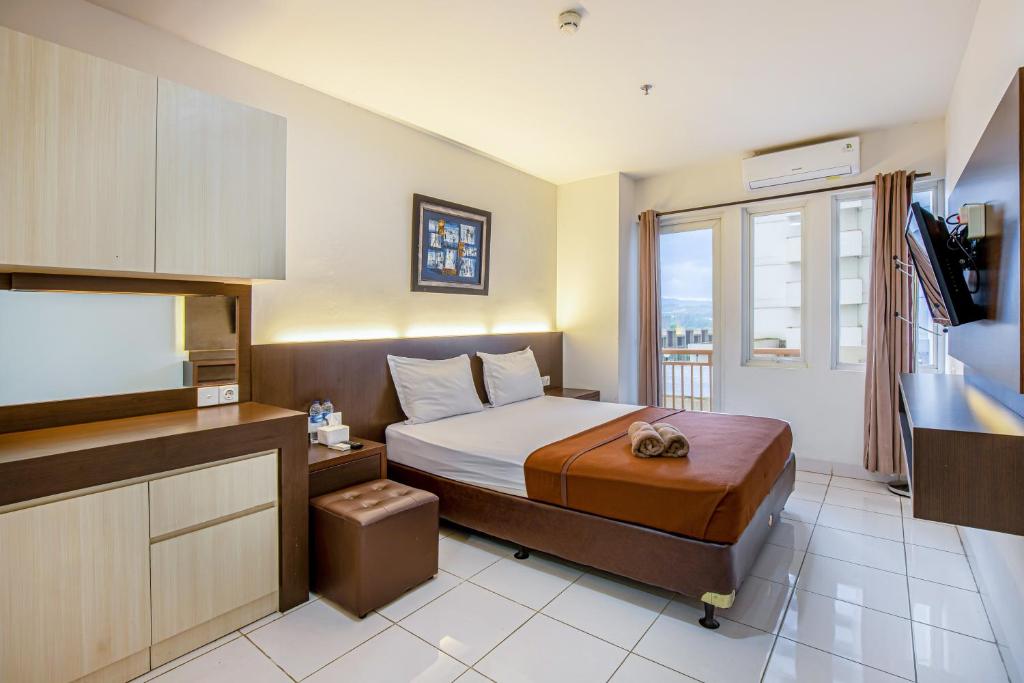 TV a/nebo společenská místnost v ubytování Skyview Sentul Tower Apartments