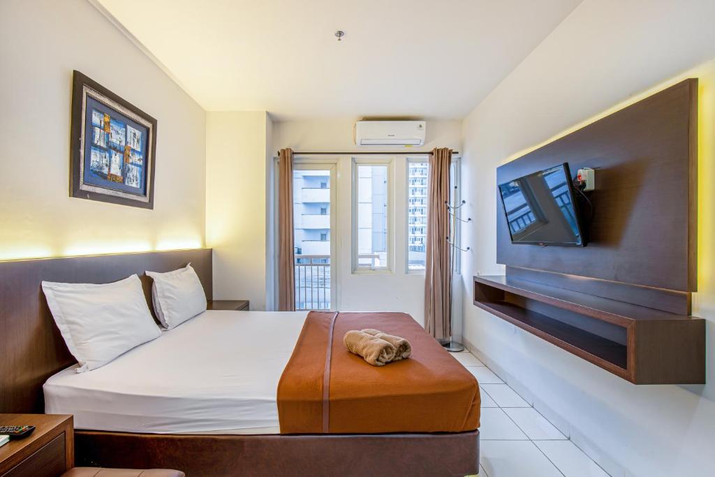 TV a/nebo společenská místnost v ubytování Skyview Sentul Tower Apartments
