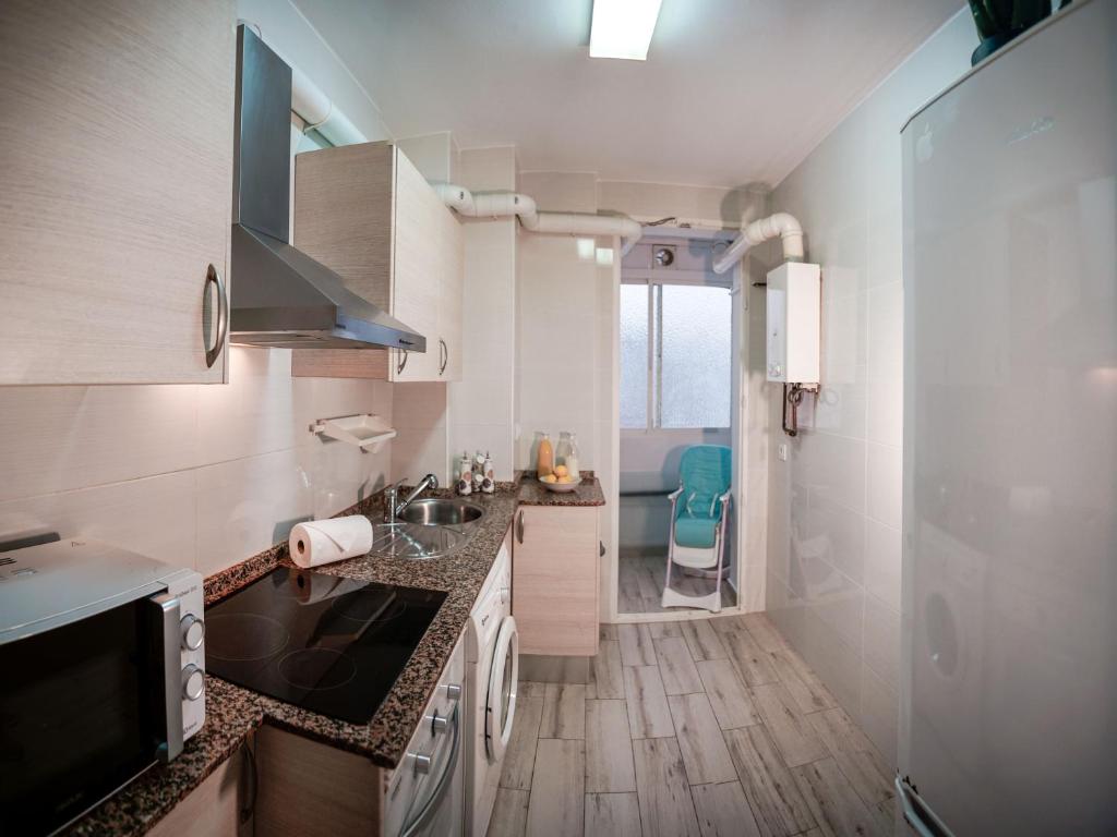 Kuchyň nebo kuchyňský kout v ubytování Sirenas Playa Ha Apartment