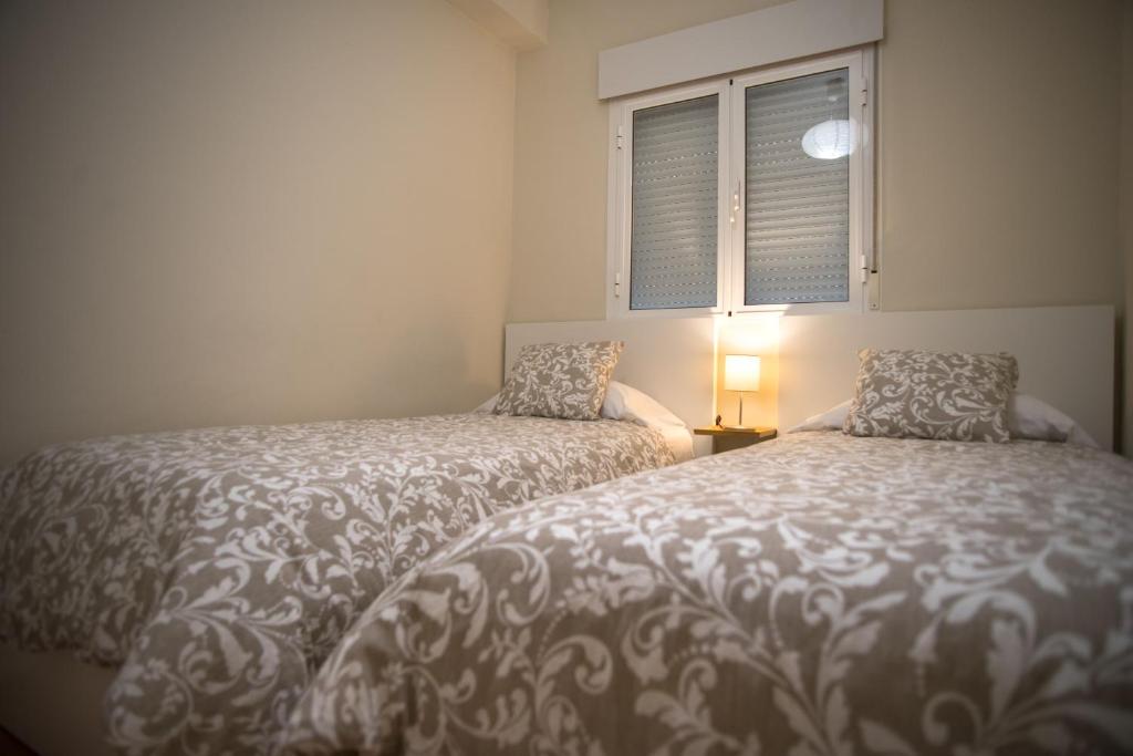 Postel nebo postele na pokoji v ubytování Sirenas Playa Ha Apartment