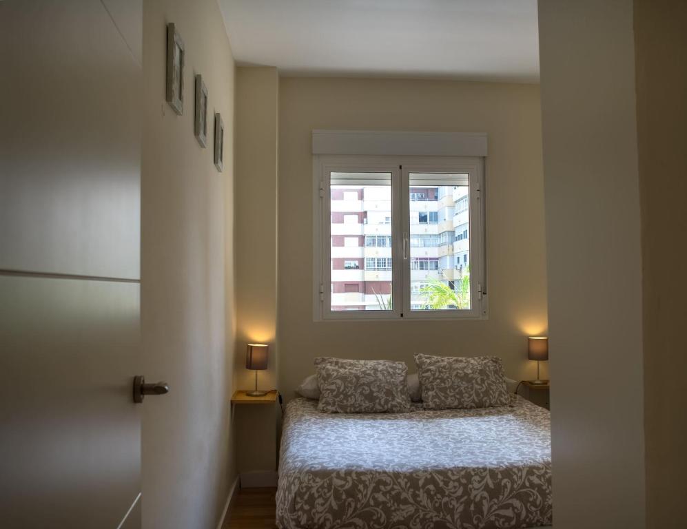 Postel nebo postele na pokoji v ubytování Sirenas Playa Ha Apartment
