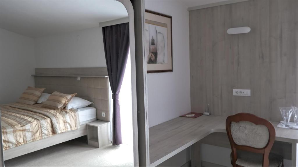 Posteľ alebo postele v izbe v ubytovaní Hotel Consul