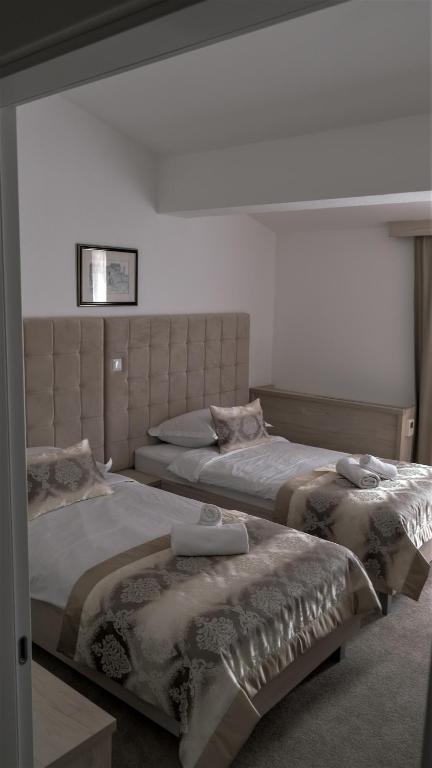 Posteľ alebo postele v izbe v ubytovaní Hotel Consul