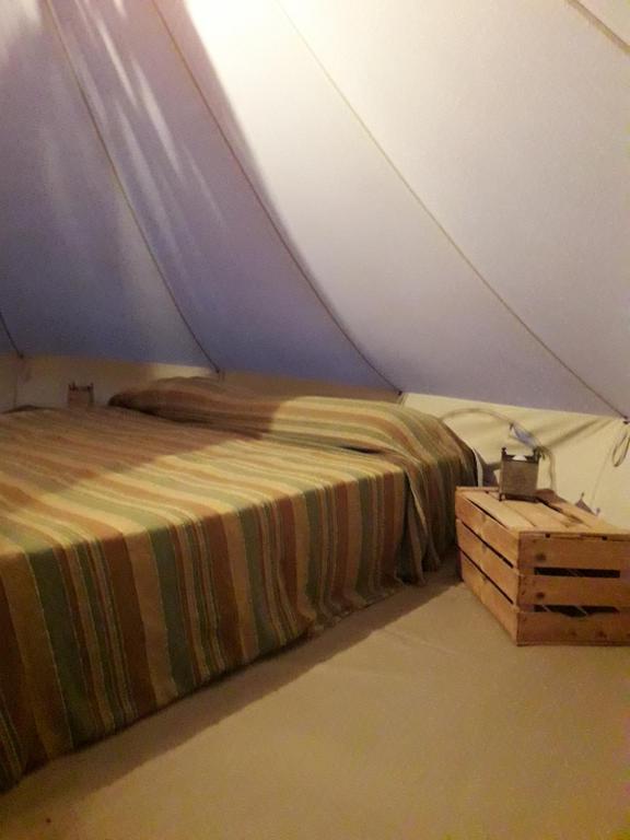 Postel nebo postele na pokoji v ubytování Macarìa Agricampeggio