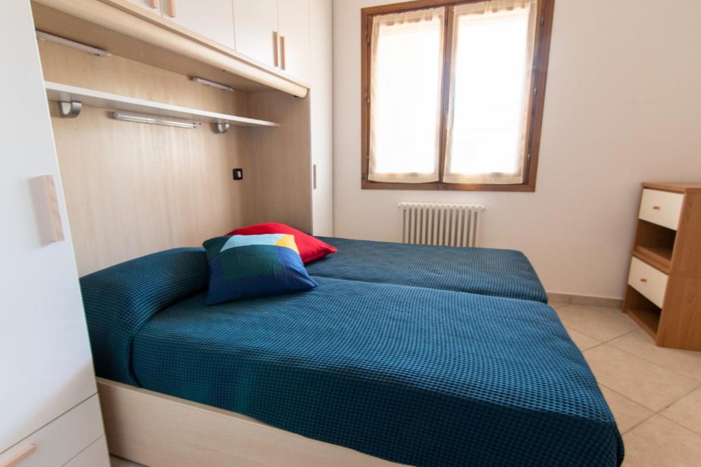 Postel nebo postele na pokoji v ubytování La Terrazza - Splendido trilocale a Lacona