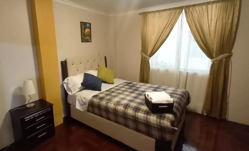 Postel nebo postele na pokoji v ubytování Dulce Hogar 02