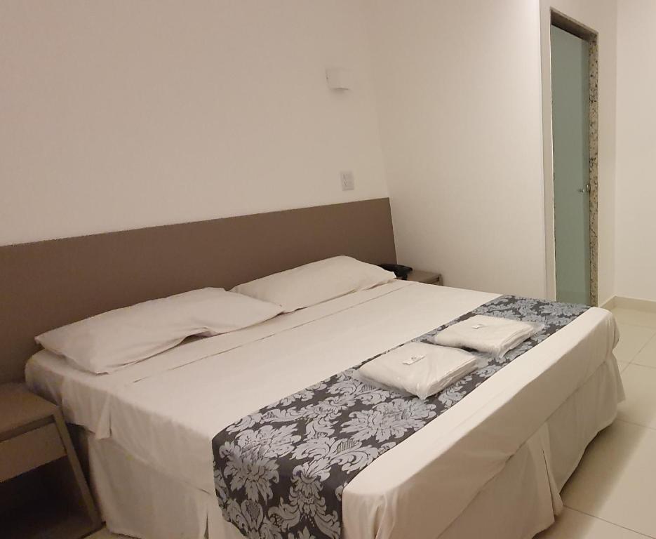 Postel nebo postele na pokoji v ubytování Hotel Hellyus