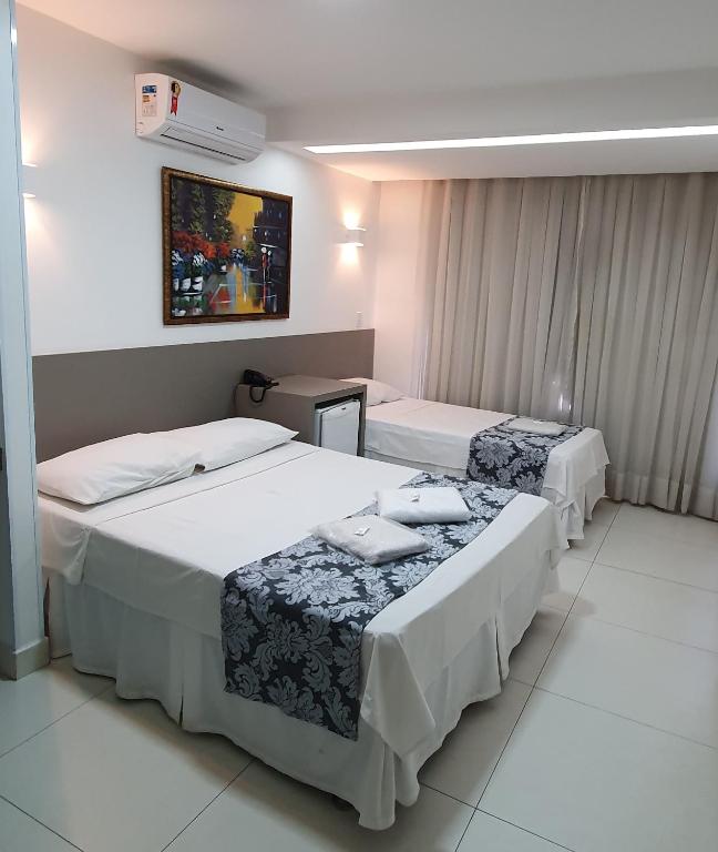 Postel nebo postele na pokoji v ubytování Hotel Hellyus