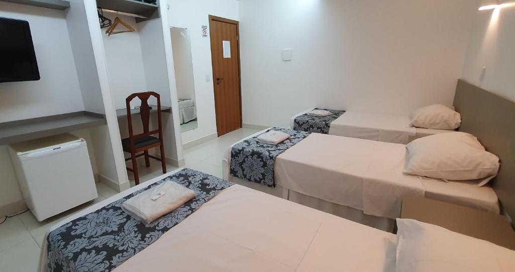 Postel nebo postele na pokoji v ubytování Hotel Hellyus