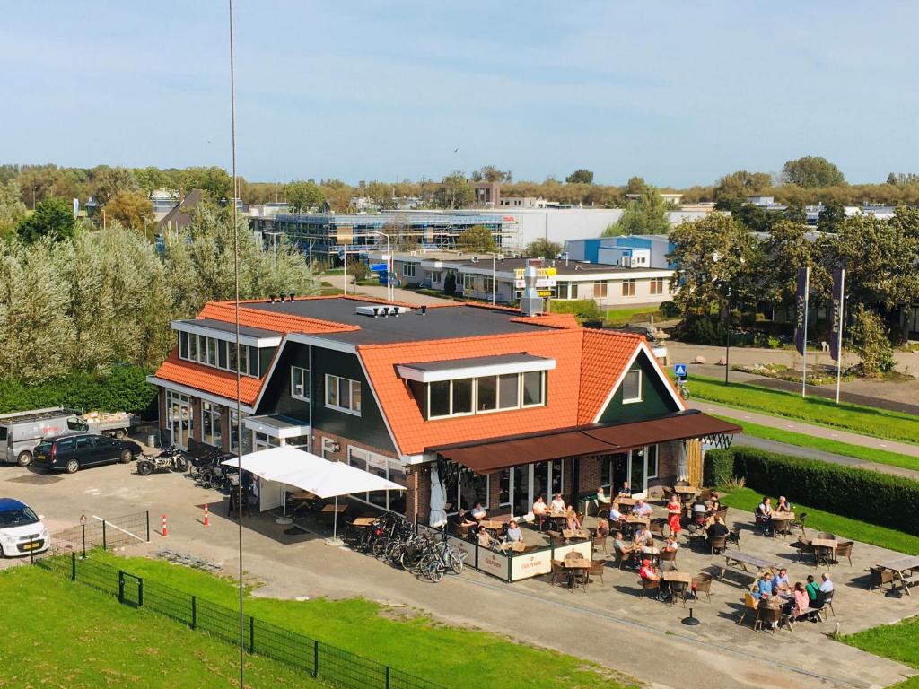 an overhead view of a building with people sitting outside at Millsight in Uitgeest