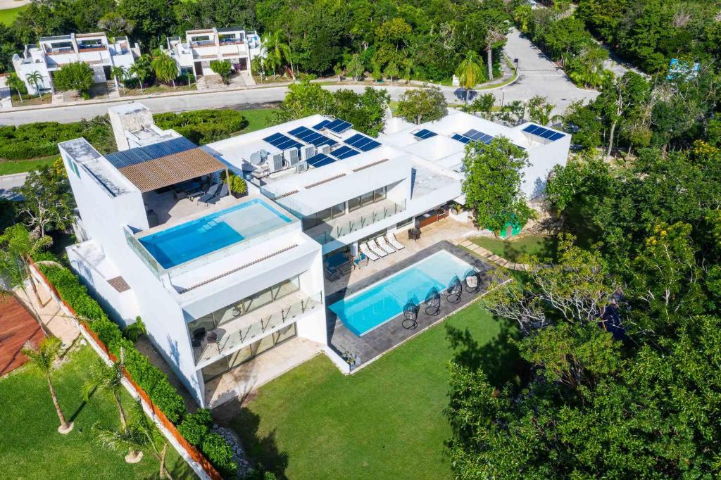an aerial view of a house with a swimming pool at Villa Maya- Luxury Mansion in Akumal