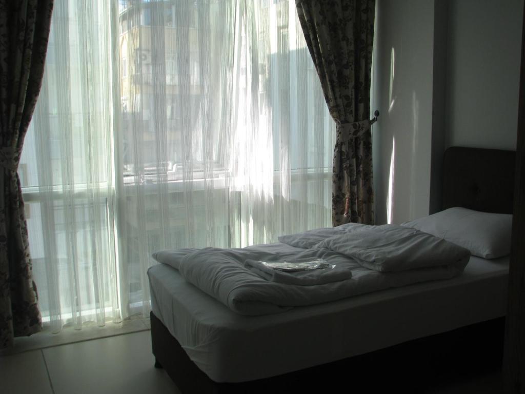 Postel nebo postele na pokoji v ubytování Yeşilyurt otel