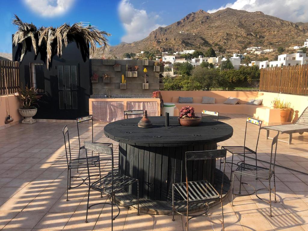 a patio with a table and chairs on a patio at LOFT "EL PARQUE" in Níjar
