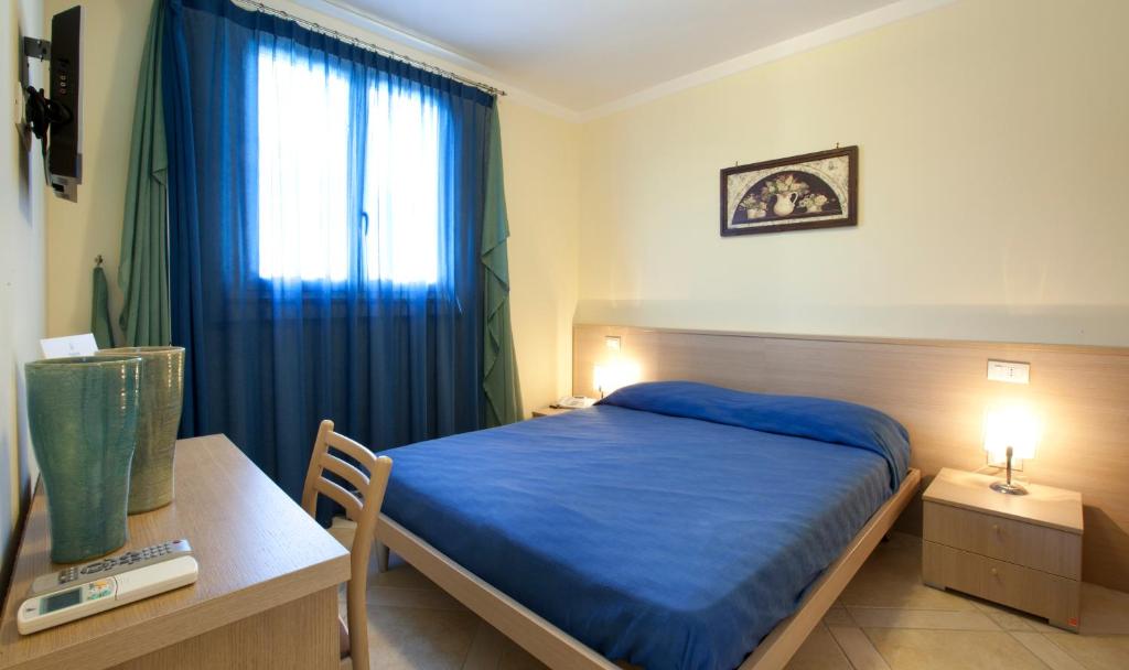 Postel nebo postele na pokoji v ubytování Posidonia Residence