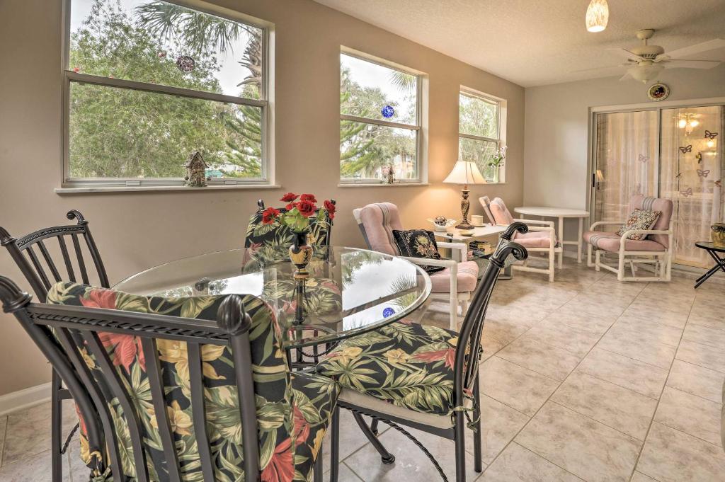 a dining room with a glass table and chairs at Pet-Friendly Home with Yard - 2 Blocks to Beach in Flagler Beach