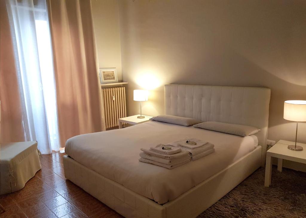 En eller flere senge i et værelse på Casa Moretti