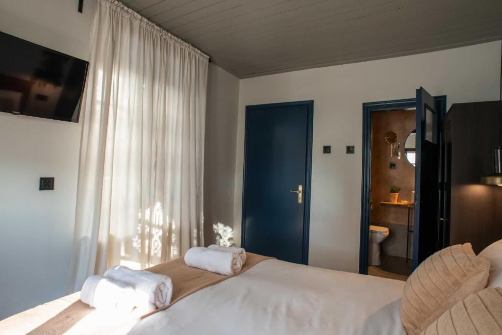 Postel nebo postele na pokoji v ubytování Philos Guesthouse