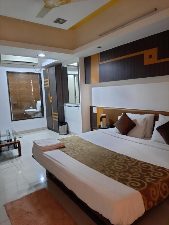 Postel nebo postele na pokoji v ubytování Hotel Grand Suites