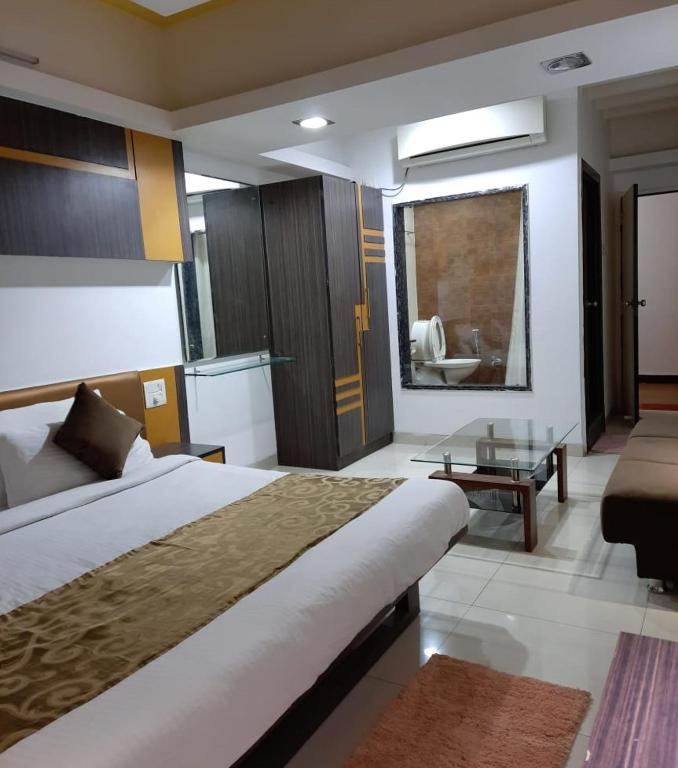 Postel nebo postele na pokoji v ubytování Hotel Grand Suites