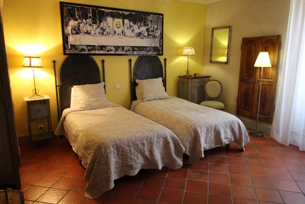 Postel nebo postele na pokoji v ubytování la parenthèse Hostellerie Provençale