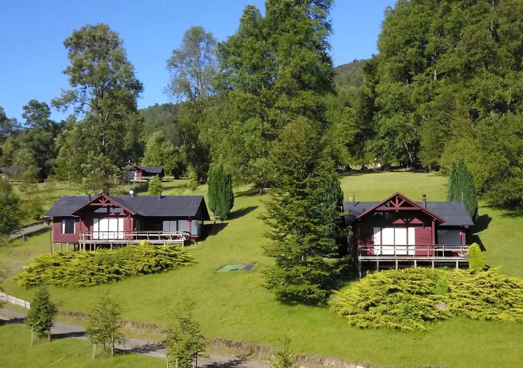 an aerial view of the cottages at the resort at Mirador Los Volcanes Lodge & Boutique in Pucón