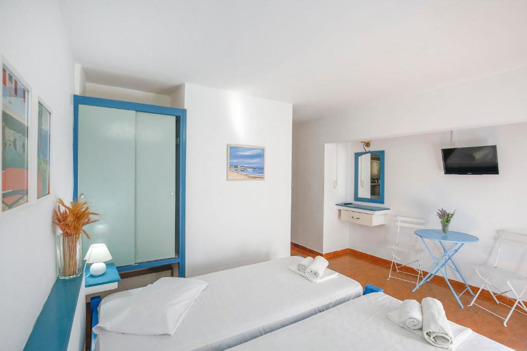 Postel nebo postele na pokoji v ubytování Hotel Asteroa