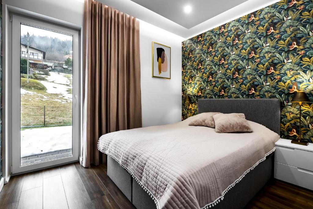 Posteľ alebo postele v izbe v ubytovaní Apartament Zacisze z prywatną sauną