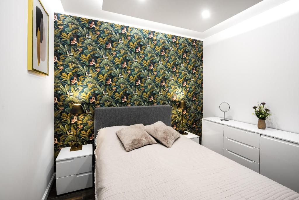 Posteľ alebo postele v izbe v ubytovaní Apartament Zacisze z prywatną sauną